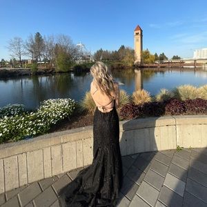 Black prom dress! lace detail, corset around the waist, open back, slit, train.